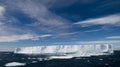 Tabular Iceberg Under Sunny, Blue Skies