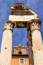 The Tabularium building peeking through the columns of the Temple of Vespasian and Titus, Roman Forum