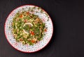 Tabule - oriental salad, appetizer on a black background copy space