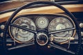 Tachometer, speedometer, clock and various gauges on a vintage car`s dashboard Royalty Free Stock Photo