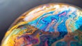 Tack-sharp photo of soap bubble surface, iridescent colors, macro view