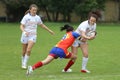 Tackle during female rugby game Royalty Free Stock Photo