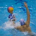 Tackle in a Water Polo Match Royalty Free Stock Photo