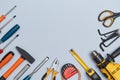 Tacks scissors tape measure screwdriver tools. Construction site and equipment. Copy space. Isolated on blue background Royalty Free Stock Photo