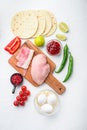 Taco ingredients homemade authentic mexican chivken meal, over white concrete background top view Royalty Free Stock Photo