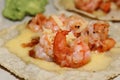 A taco of shrimp on a tortilla