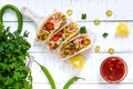 Taco - wheat tortilla with meat, vegetables, corn, greens. Delicious mexican snack Royalty Free Stock Photo