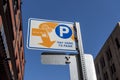 Tacoma, WA USA - circa August 2021: Low angle view of a Pay Here To Park sign in downtown Tacoma on a sunny, cloudless day Royalty Free Stock Photo
