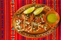 Tacos al pastor and lemons green sauce mexican spicy food in mexico city Royalty Free Stock Photo