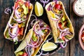 Tacos with chicken meat, vegetables and fresh greens