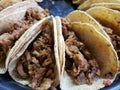 Tacos with corn tortilla, stuffed with pork, traditional Mexican food