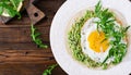 Tacos with guacamole, fried egg and arugula. Healthy food.