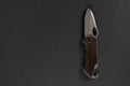 tactical folding knife. EDC knife. on dark background Royalty Free Stock Photo