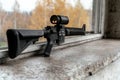 Tactical rifle with scope on wooden surface Royalty Free Stock Photo