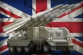 Tactical short range ballistic missile on the United Kingdom UK national flag background. 3d Illustration