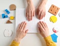 Tactile learning board showing textured shapes arranged systematically for visually impaired education Royalty Free Stock Photo