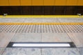 Tactile paving for visually impared at subway platform. yellow l