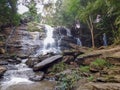 A Thai man looks at a waterfall in northern Thailand