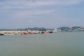 Fishing boats moored to concrete pier at Druny harbor