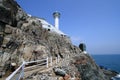 Sea, sky, promontory, coast, lighthouse, rock, terrain, cape, cliff, tower, mountain, coastal, and, oceanic, landforms, klippe, oc Royalty Free Stock Photo