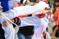 Taekwondo athletes fighting on stage Royalty Free Stock Photo