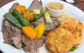 Tafelspitz boiled filet of beef with vegetables and fried potato cake