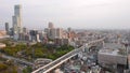 Taffic on elevated roadway and green park of Osaka City Museum of Fine Arts, Japan