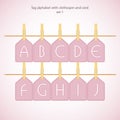 Tag alphabet with clothespin and cord