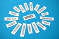 SERVICE paper tag cloud on blue background Royalty Free Stock Photo