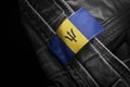 Tag on dark clothing in the form of the flag of the Barbados