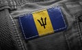 Tag on dark clothing in the form of the flag of the Barbados