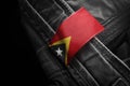 Tag on dark clothing in the form of the flag of the East Timor