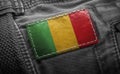 Tag on dark clothing in the form of the flag of the Mali