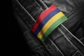 Tag on dark clothing in the form of the flag of the Mauritius