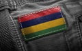 Tag on dark clothing in the form of the flag of the Mauritius