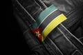 Tag on dark clothing in the form of the flag of the Mozambique