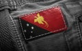 Tag on dark clothing in the form of the flag of the Papua New Guinea