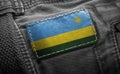 Tag on dark clothing in the form of the flag of the Rwanda