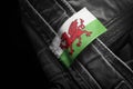 Tag on dark clothing in the form of the flag of the Wales