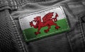 Tag on dark clothing in the form of the flag of the Wales