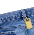 Tag lable on jeans fabric background.