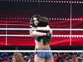 Tag team partners AJ Lee and Paige hug after match at Wrestlemania match