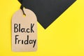 Tag with words BLACK FRIDAY on background, top view. Space for text Royalty Free Stock Photo