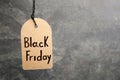 Tag with words BLACK FRIDAY hanging on background. Space for text Royalty Free Stock Photo