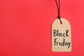 Tag with words BLACK FRIDAY on background, top view. Space for text Royalty Free Stock Photo