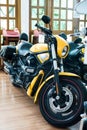A yellow limited edition of Harley Davidson big bike inside the house