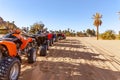 Quads parked in line ready to be rented by tourists.