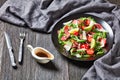 Tagliata sirloin steak salad on a black plate