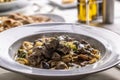 Tagliatelle con salsiccia e porcini, Italian pasta with sausage and summer cep mushroom Royalty Free Stock Photo