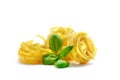 Tagliatelle italian pasta with basil isolated on white background Royalty Free Stock Photo